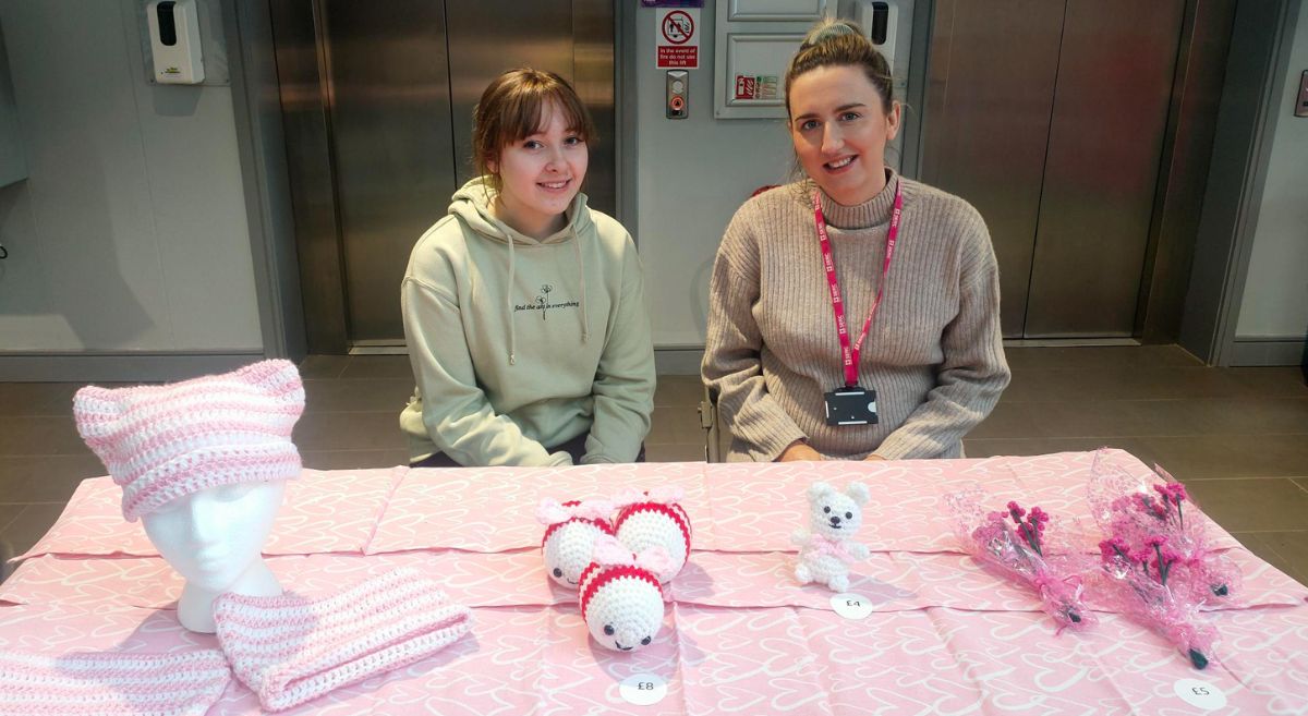 Picture of a SERC student and staff member at Valentines Markets